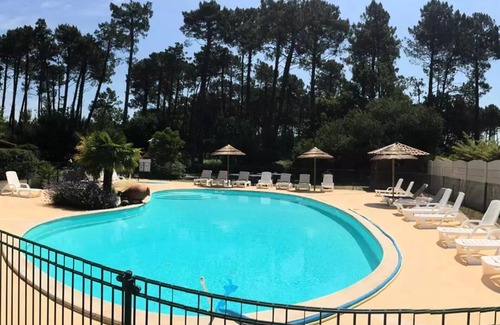 Biscarrosse Ski Chalet | En Chon Les Pins - Camping-Caravaning * - Chalet wood 30m2 -2 bedrooms DIMANCHE - DIMANCHE n° 53 4 to 5 people - 4 pers. included in the tariff
