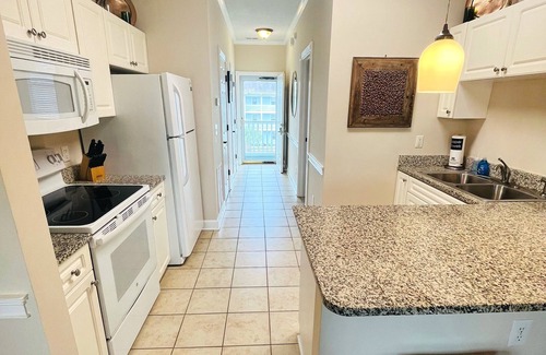 Central Myrtle Beach Condo | Endless Summer Cozy Condo at Magnolia Place - Golf Course Views!