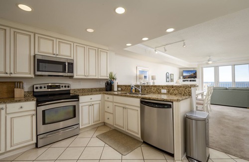 Ocean City Condo | Enjoy a large, spacious designer unit with all the extras plus an indoor pool, outdoor pool, fitness room, assigned parking and shops on the ground level.