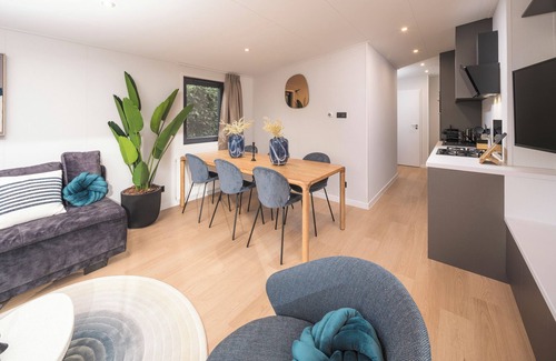 Lieren House | Enjoy a luxury holiday home in the wooded nature of the Veluwe, featuring modern amenities, air conditioning, and a stylish pergola for optimal comfort.