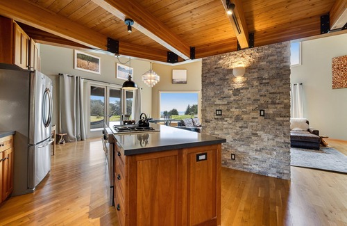 Sea Ranch House | Enjoy a private hot tub, deck, distant ocean view, fireplace, and pool