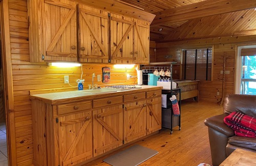 Pleasant Grove Cabin | Enjoy a warm fire! Fish in the lake or river, relax in the Outhouse Lounge