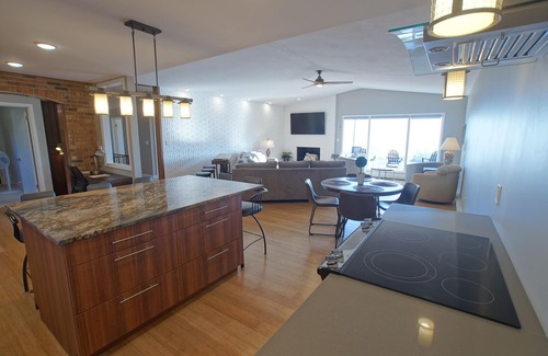St Ignace House | Enjoy cool breezes, take in lake and island views from this updated modern home.
