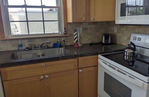 Midtown Ocean City Condo | Enjoy Ocean views from your top unit furnished porch Free linens