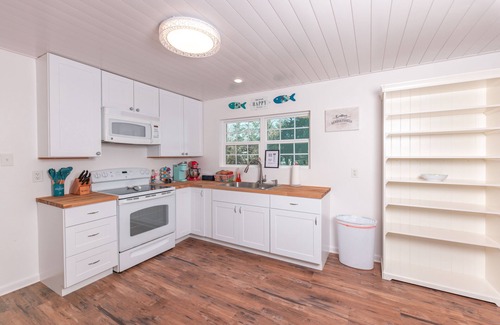 Sunrise Beach Village Cottage | Enjoy our speakeasy at our 2 bedroom cottage!