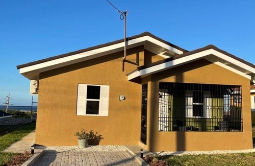 Falmouth House | Enjoy peace and serenity in this lovely home boasting sea view