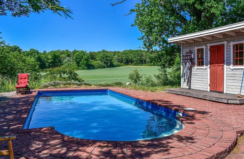 Alstugorna House | Enjoy refreshing dips in the pool in this vacation home.