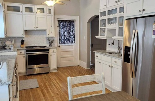 Mount Airy House | Enjoy small-town, Main Street from the front porch of this historic bungalow!