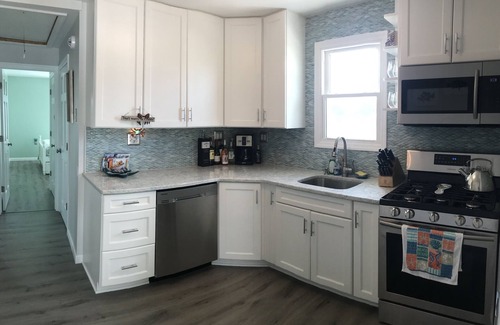 Ortley Beach House | Enjoy sunsets at this modern cottage with large backyard and peekaboo bay view.