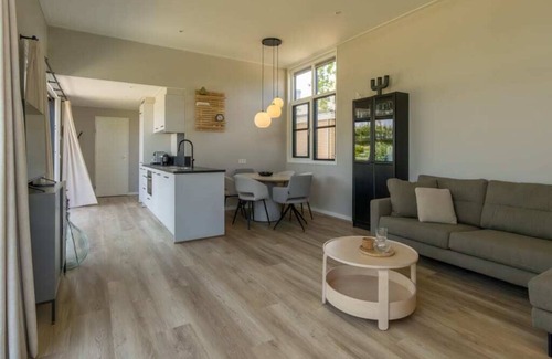 Burgh-Haamstede House | Enjoy the outdoors in this luxury chalet at Duinvilla’s Schouwenduin with a large sliding door, high