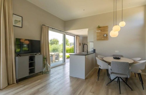 Burgh-Haamstede House | Enjoy the outdoors in this luxury chalet at Duinvilla’s Schouwenduin with a large sliding door, high