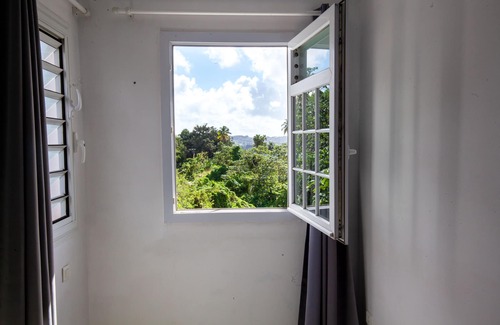 Gros-Morne Villa | Enjoy the peace and quiet of nature in this fresh, bright villa.