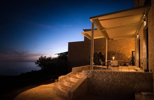 Stoupa Villa | Enjoy the relaxation of chic seaside living in a sea view stone villa