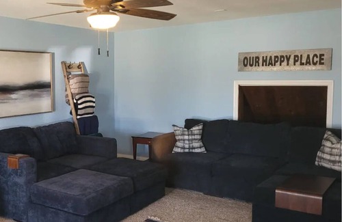 Dennis Cottage | Enjoy the river with a pool, firepit and a balcony with a gorgeous water view.