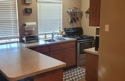 Dennis Cottage | Enjoy the river with a pool, firepit and a balcony with a gorgeous water view.