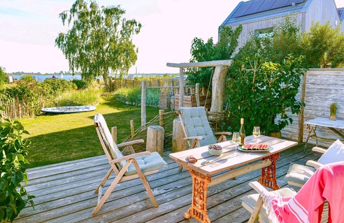 Fehmarnsund Apartment | Enjoy your vacation: Terrace, fireplace & sea view at BEACHHOUSE-Fehmarn -Ostwind