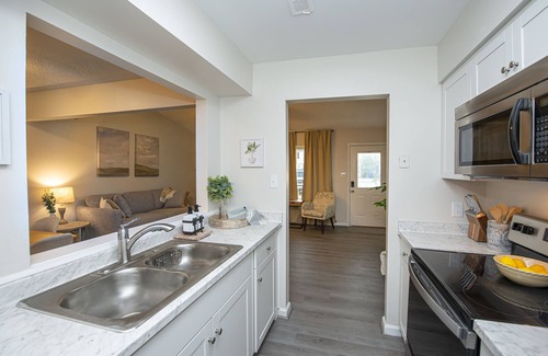 Norfolk - Virginia Beach House | Enticing Den with Backyard and Indoor Fireplace