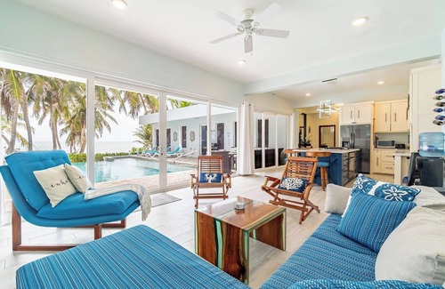 San Pedro House | Escape to this stunning 4-bedroom villa nestled on the white sands of northern Ambergris Caye, Belize.