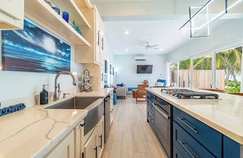 San Pedro House | Escape to this stunning 4-bedroom villa nestled on the white sands of northern Ambergris Caye, Belize.