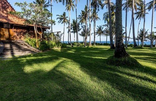 Jasri Villa | Exquisite beachfront joglo in lush coconut grove