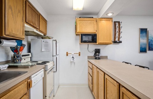 Rockaway Beach Condo | Extraordinary Oceanfront Views at Rockaway Creek Inn, Patio and Living Area Bathed In Natural Light
