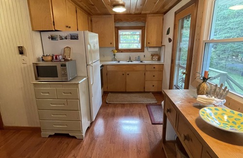 Lake Leelanau Cottage | Fall 2025 open, stunning, cozy, sunset waterfront on N Lake Leelanau.