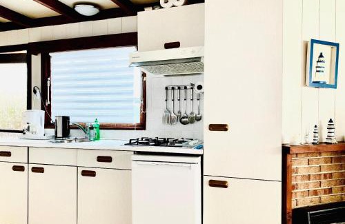 Onderdijk Apartment | Familienfreundlisches Ferienhaus "Angel mit Garten und Terrasse am Ijsselmeer Grote Vliet Niederlande