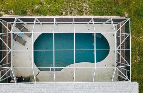 Pinehurst House | Family Friendly 3BR with Sunset Views Heated Pool Canal Front near Beach