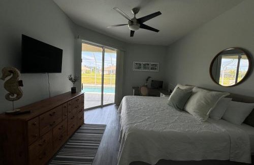 Pinehurst House | Family Friendly 3BR with Sunset Views Heated Pool Canal Front near Beach