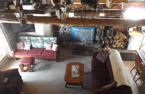 Perronville Cabin | Family friendly comfy log lodge and pond.