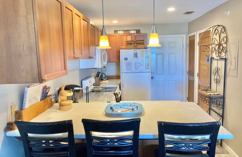 Ono Island Condo | Family Friendly & Quiet Riverside Condo with Pool & Fishing Piers
