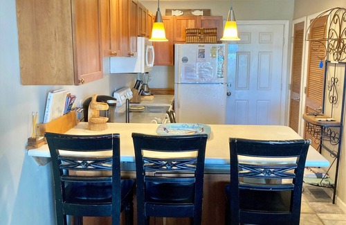 Ono Island Condo | Family Friendly & Quiet Riverside Condo with Pool & Fishing Piers