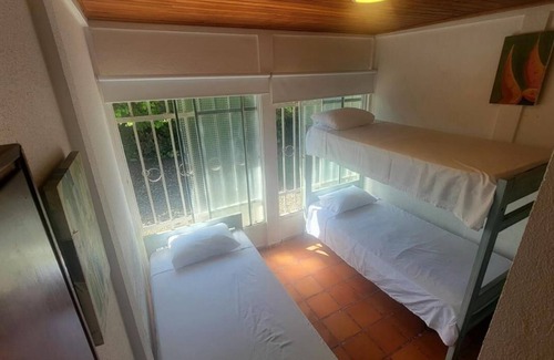 Apiay Hotel | Family room with private bathroom