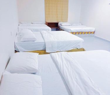 Bukit Kecil House | Family room with private bathroom