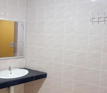 Bukit Kecil House | Family room with private bathroom