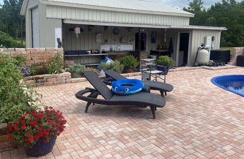 Magnolia Bluffs House | Family secure home with your own Tiki Hut close to Beach SGI. Clean and modern.