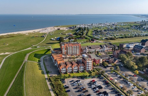 Schillig Apartment | Family vacation apartment close to the beach on the North Sea with balcony and sea view - Hus