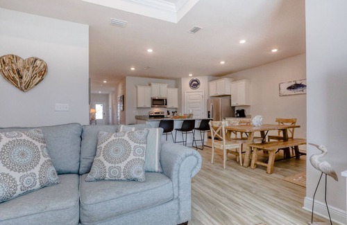 Port St. Joe House | Fantastic coastal home with beach boardwalk, shared pool, private porch & WiFi