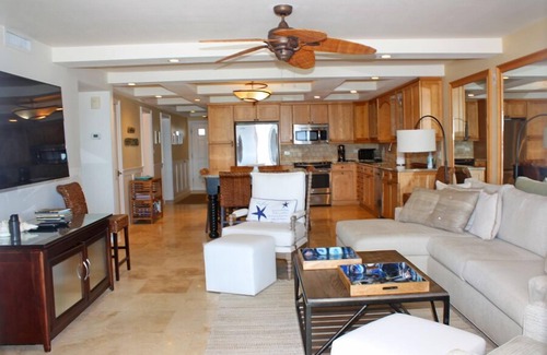 New Smyrna Beach Condo | Fantastic Oceanfront three bedroom. Travertine floors, custom kitchen and bathrooms. Luxury Condo!