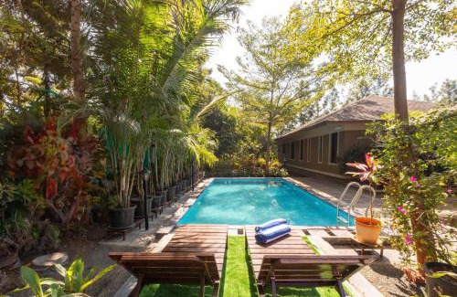 Nashik Villa | Farmhouse Retreat by StayVista - Classic architecture, Rustic interiors, Cozy rooms & A refreshing swimming pool