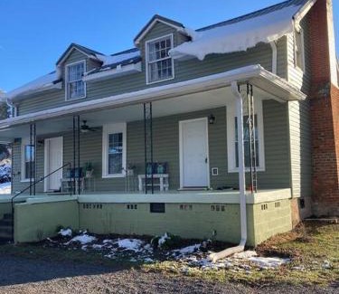 Johnson City House | Farmhouse with game room, fire pit and creek