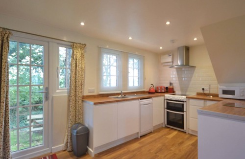 Saint Erth Praze Cottage | Farmland views to the rear of the property, and located within the grounds of Tolroy Manor