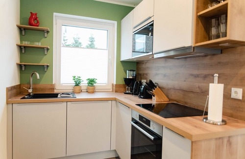 Tannenhausen House | Ferienhaushälfte Straßenseite - Küsten Apartments Tannenhausen