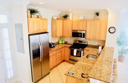 Coral Lagoon House | Finest location in Coral Lagoon. End unit with bay views and boat slip!