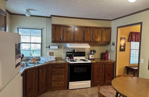 Hornbeak House | Fish cleaning station, screened porch, covered front porch, fire pit, 3 BR