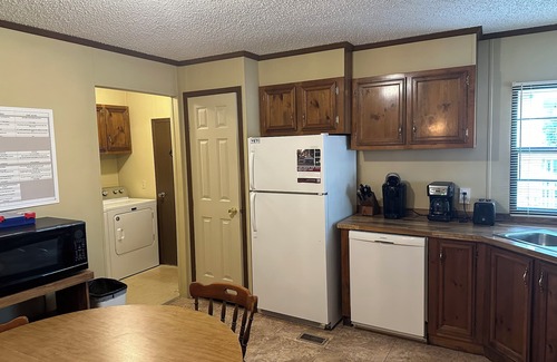 Hornbeak House | Fish cleaning station, screened porch, covered front porch, fire pit, 3 BR