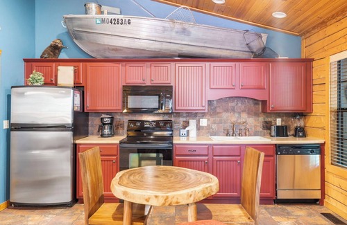Branson Theater District Cabin | Fishing Themed Retreat for Two - King Bed Cabin with Fireplace & Jacuzzi Tub