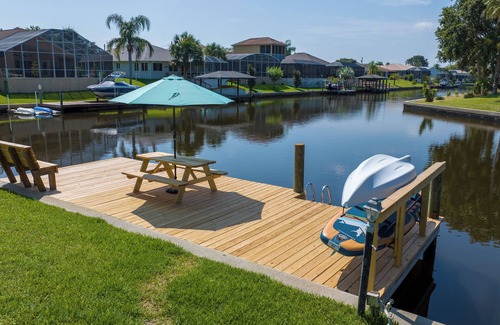Palm Harbor House | Five Star 3bd Waterfront Canal Home w/Private Pool/Spa & Boat Dock.
