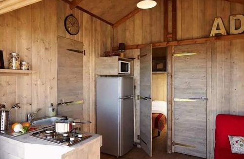 Souillac House | Flower Camping Les Ondines * - Cabane Lodge Wood on stilt Comfort 38m2 (2 bedrooms) including covered terrace 12m2 + TV 4 persons