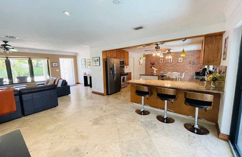 Coral Ridge Isles House | Fort Lauderdale 4/2 with screened-in pool and dock.